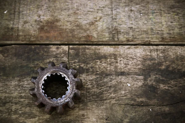 Old machine parts in machinery shop on wooden background.old machine with vintage picture style. — Stock Photo, Image