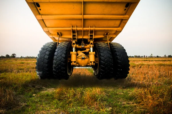 Heavy mining truck in mine and driving along the opencast. Photo of the big mine truck, The career heavy-load super car. Stock Photo