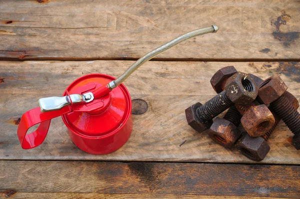 Oil can on wooden background, Lube oil can and used in industry or hard works. — Stock Photo, Image