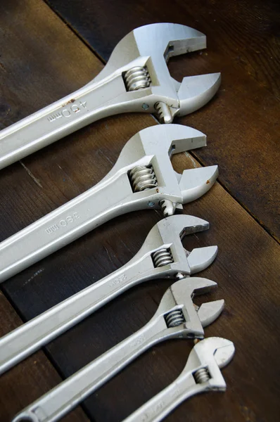 Spanner or adjustable wrench on wooden back ground, Basic hand tools. — Stock Photo, Image