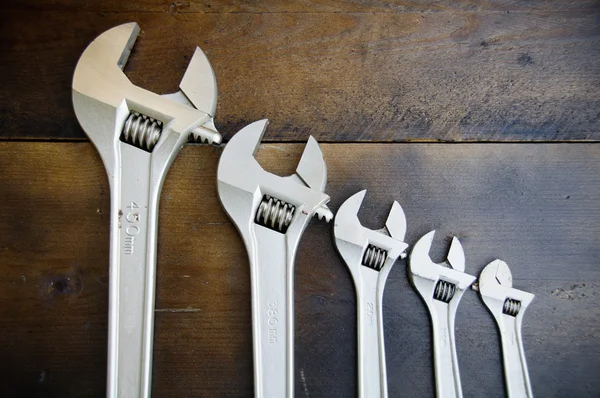 Spanner or adjustable wrench on wooden back ground, Basic hand tools. — Stock Photo, Image