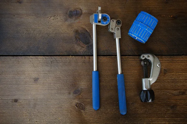 Tube bender or pipe bender tools on wooden background. — Stock Photo, Image