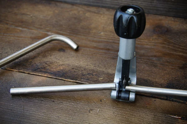 Tube bender or pipe bender tools on wooden background. — Stock Photo, Image