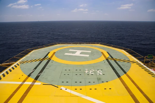 Helideck of oil and gas drilling rig in offshore industry, Helicopter landing area on construction platform in offshore of oil and gas industry or energy business for transfer passenger.