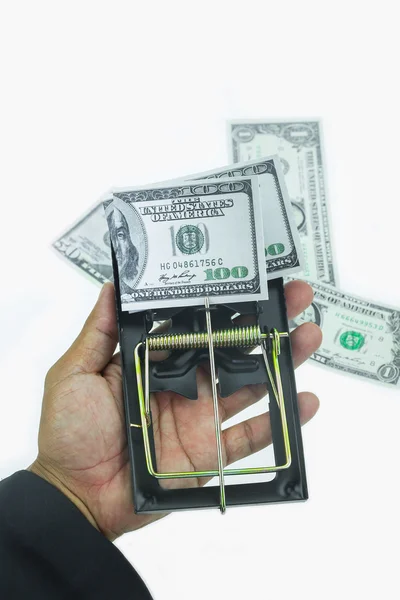 Trap with dollar bills isolated over white background, Risk in business, Businessman taking money from a mousetrap — Stock Photo, Image