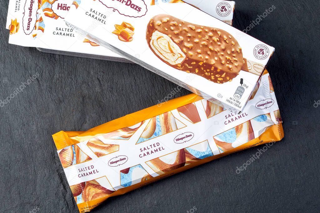 KIEV, UKRAINE - DECEMBER 24, 2020: Haagen Dazs salted caramel ice cream in packaging on a black background top view