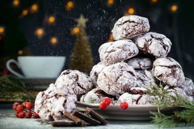 Home baked chocolate crinkle cookies in icing sugar. Cracked chocolate biscuits . clipart