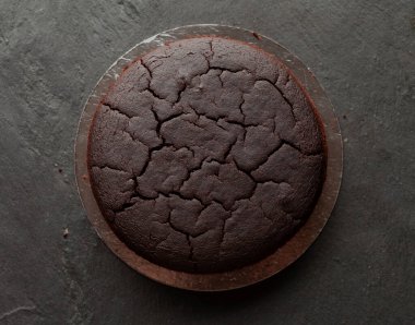 Chocolate cake layers on black graphite background