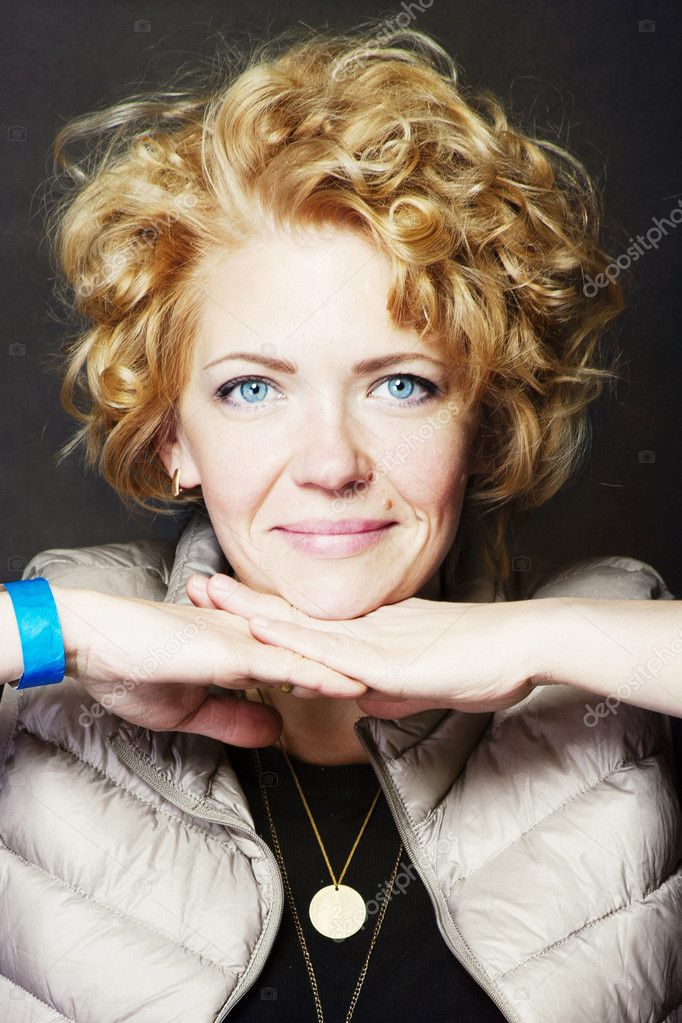 beautiful girl with curly golden hair and blue eyes