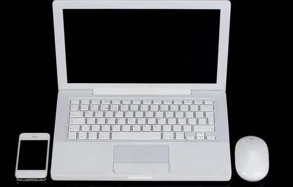 White laptop, phone and a computer mouse on the desktop. — Stock Photo, Image