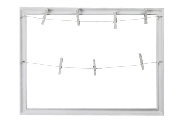 Weißer Holzrahmen mit Wäscheklammern auf weißem Hintergrund — Stockfoto