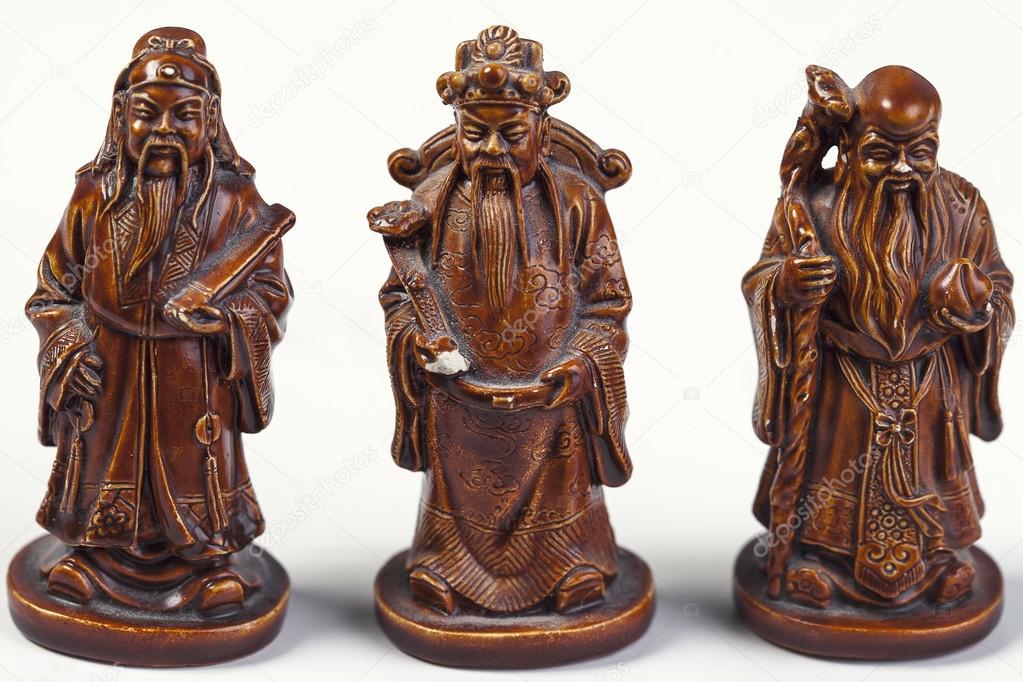 Three Chinese figurine on a white background