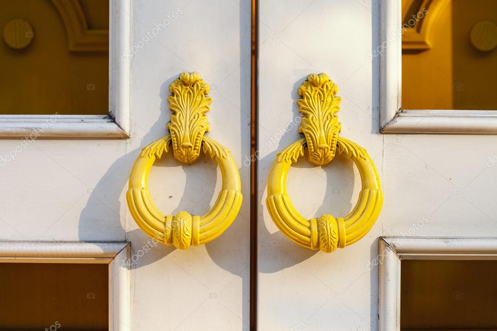 Yellow door handles on the front door white. Bright door Stock Photo by ©OlesyaKuzina 81791214