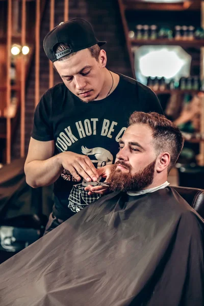 Handsome barber making beard grooming — Stock Photo, Image