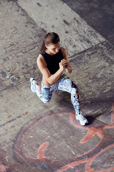 Top view one woman exercising fitness workout lunges