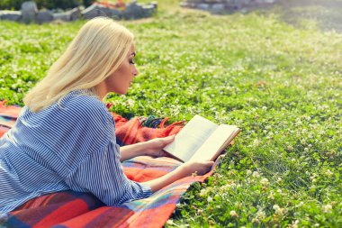 Young teen girl read book and study homework outdoor