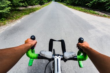 Cycling in the forest. Eye view from cyclist head