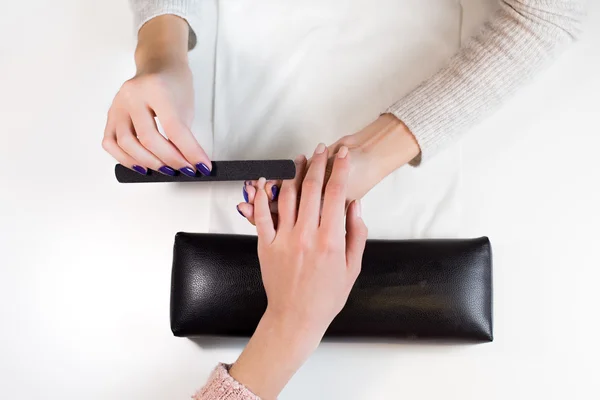 Manicurist at work nail file hand little finger — Zdjęcie stockowe