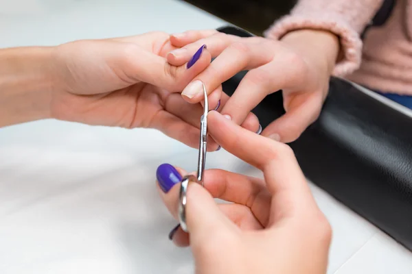 Cuticle clipping, cutting skins manicure treatment — Stock Image Cuticle clipping, cutting skins manicure treatment Royalty Free Stock Images