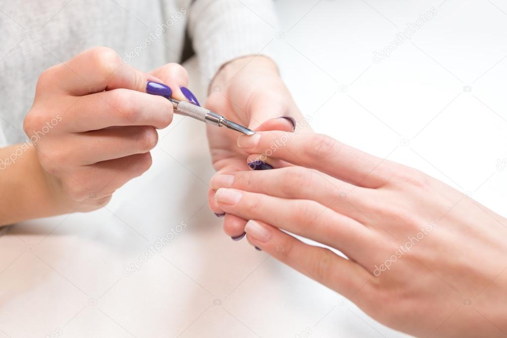 Manicure process  professional tools female hand
