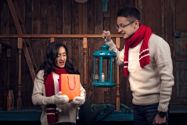 Girl and boy look in bag with Christmas gifts — 图库照片