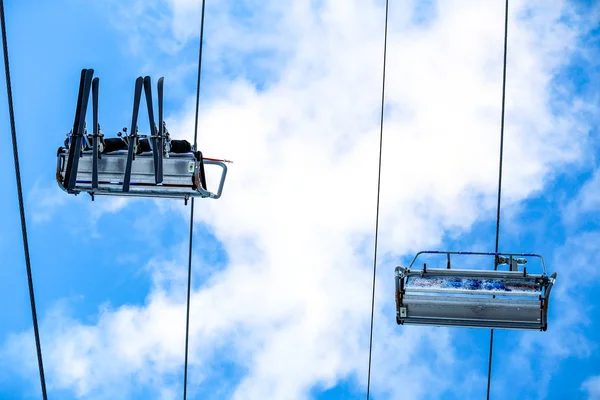 Bottom view ski family on chair lift — Stock Photo, Image