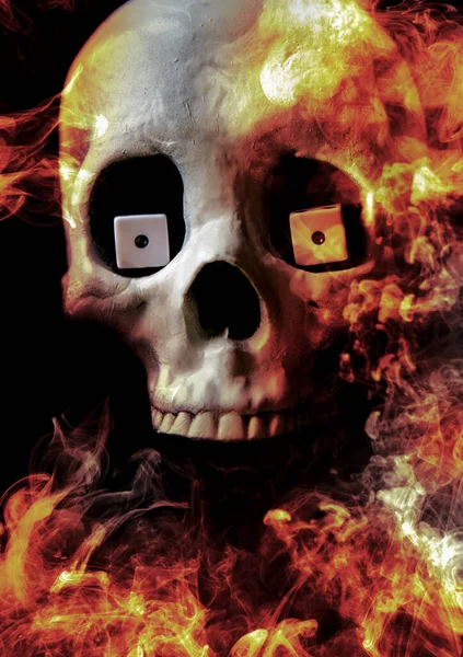 Skull burning in hell with gambling dice concept