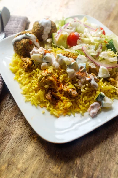 NYC street style Halal chicken and yellow rice with falafel and pita bread