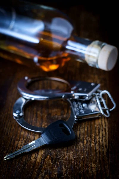 Half Empty Bottle Whisky Rustic Wooden Bar Keys Handcuffs Symbolizing — Stock Photo, Image