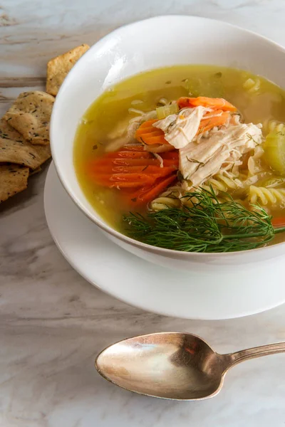 Winter cold cure chicken noodle soup with hexagon multigrain crackers — Stock Image Winter Cold Cure Chicken Noodle Soup Hexagon Multigrain Crackers Stock Photo