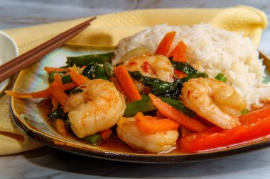 Thai food sauteed spicy shrimp pad basil with mixed vegetables