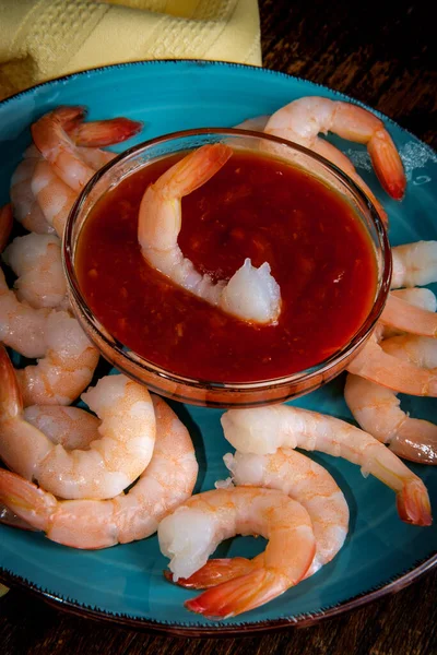 Delightful tail-on shrimp cocktail served with horseradish dipping sauce