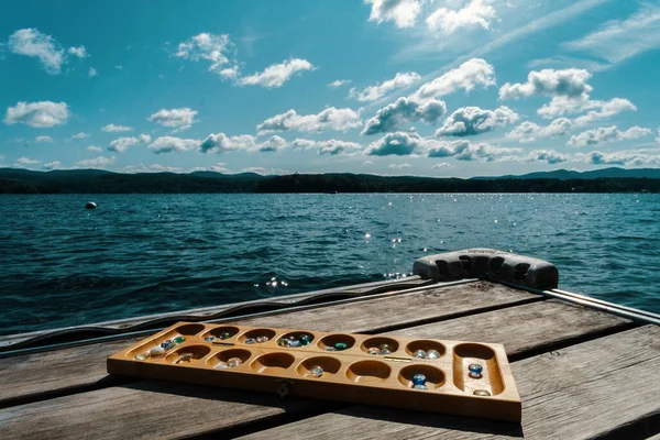 Traditional Mancala Boardgame Glass Pieces Set Dock Lake Summer Day — Stock Photo, Image