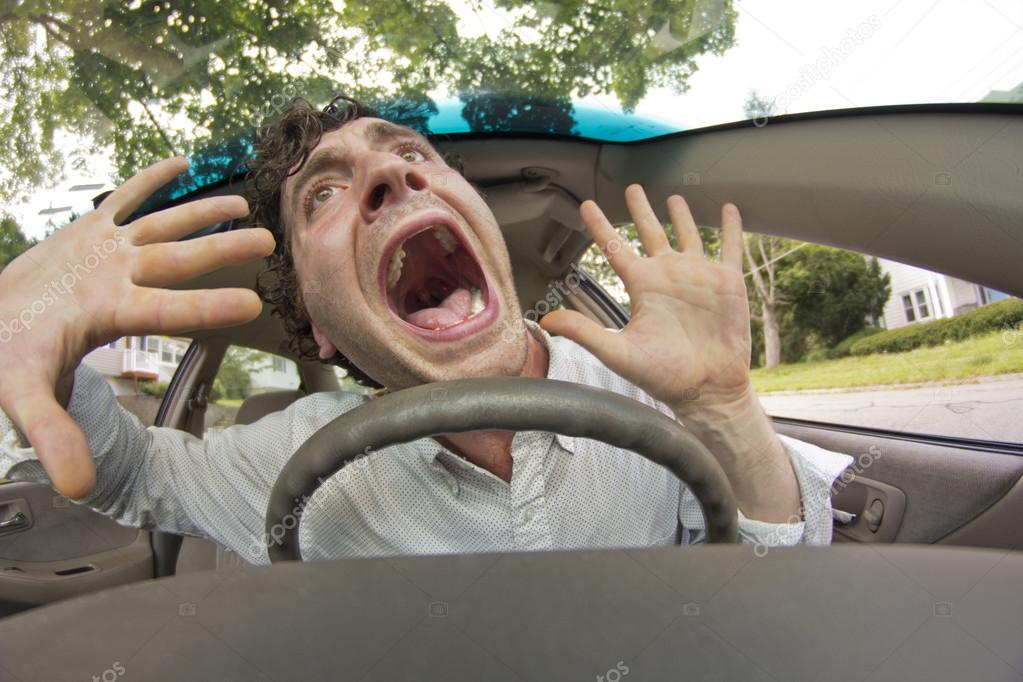 Car Crash Facial Expression — Stock Photo © Ezumeimages 90515440