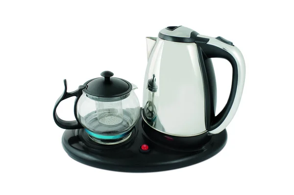 Bule de chá e uma chaleira em um suporte — Fotografia de Stock
