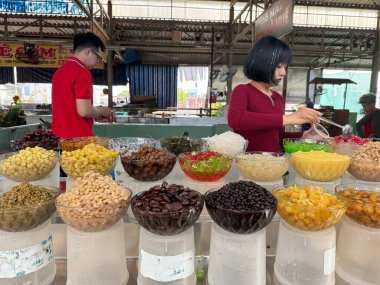 Colorful Vietnamese Che Thap Cam sweet dessert from the Mekong Delta with beans jelly coconut milk crushed ice tropical refreshing taste symbol of Southern Vietnam traditional cuisine and culture