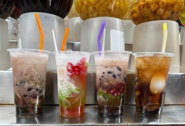 Colorful Vietnamese Che Thap Cam sweet dessert from the Mekong Delta with beans jelly coconut milk crushed ice tropical refreshing taste symbol of Southern Vietnam traditional cuisine and culture