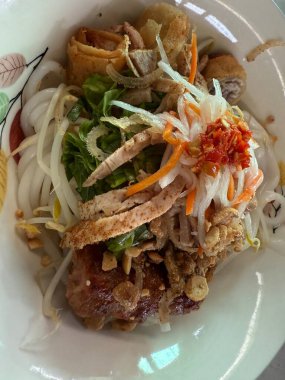 Delicious Vietnamese spring rolls with grilled meat fresh herbs rice noodles and dipping sauce traditional Asian cuisine vibrant street food healthy and flavorful authentic meal presentation