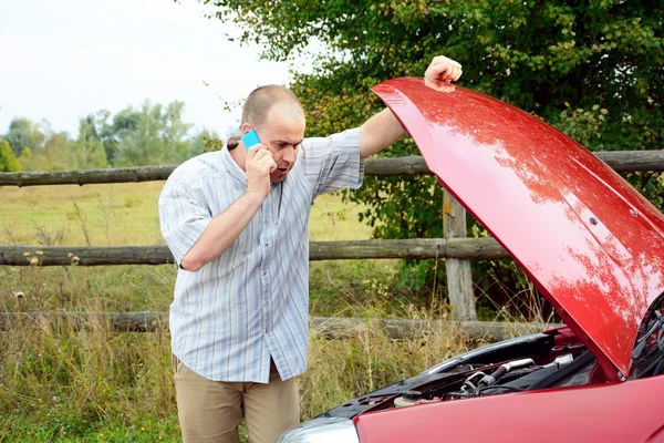 Adult man is calling to support Royalty Free Stock Images