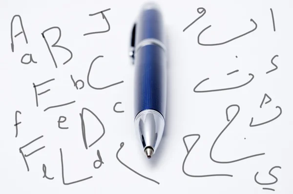 Pen with english and arabic letters — Stock Photo, Image