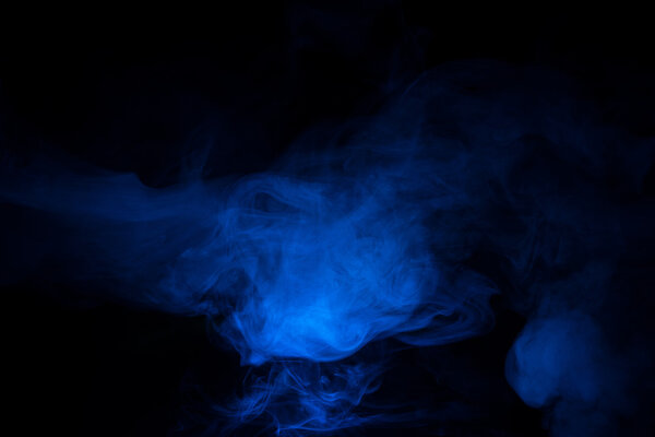 Blue smoke on a dark background