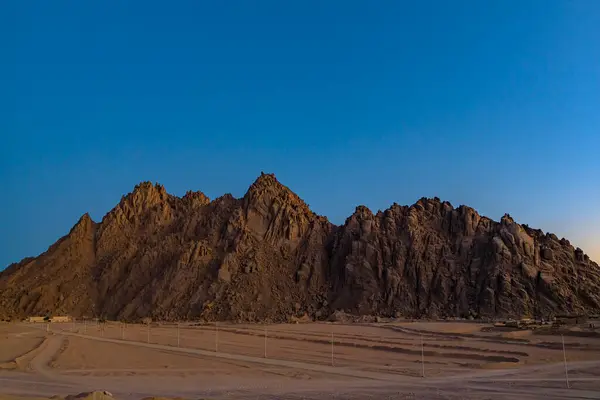 Mountain in sand desert. Mountains and clear sky near Sharm El Sheikh, Egypt