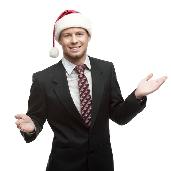 Businessman in santa hat smiling Royalty Free Stock Photos