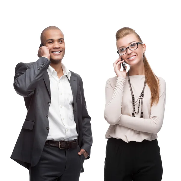 Happy smiling business people calling by mobile telephone — Stock Photo, Image