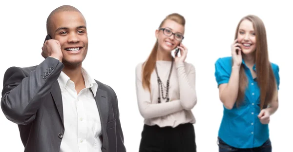 Happy smiling business people calling by mobile telephone — Stock Photo, Image