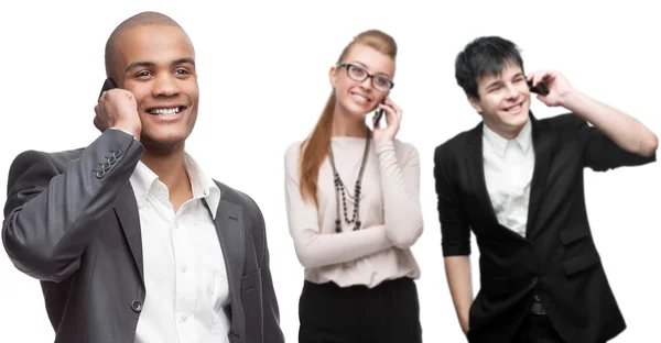 Happy smiling business people calling by mobile telephone — Stock Photo, Image