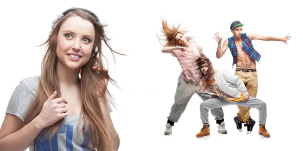 Young woman listening music and group of dancers on background — Stock Photo, Image