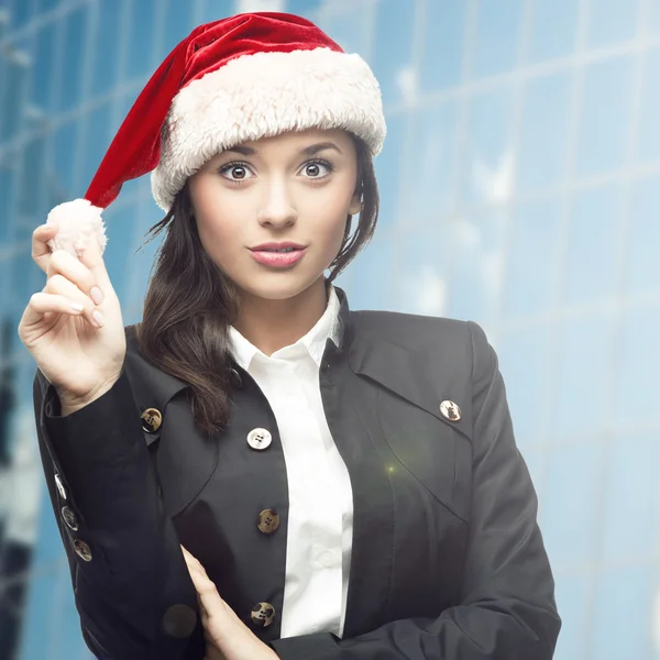 Geschäftsfrau mit Weihnachtsmann-Hut — Stockfoto