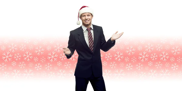 Young business man in santa hat showing empty space over winter — Stock Photo, Image