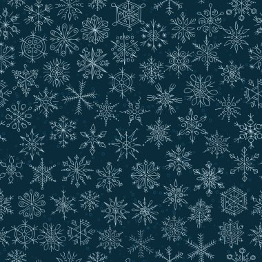 Koyu mavi arkaplanda kar taneleri